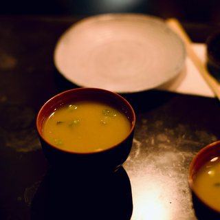 A bowl of miso soup at the counter
